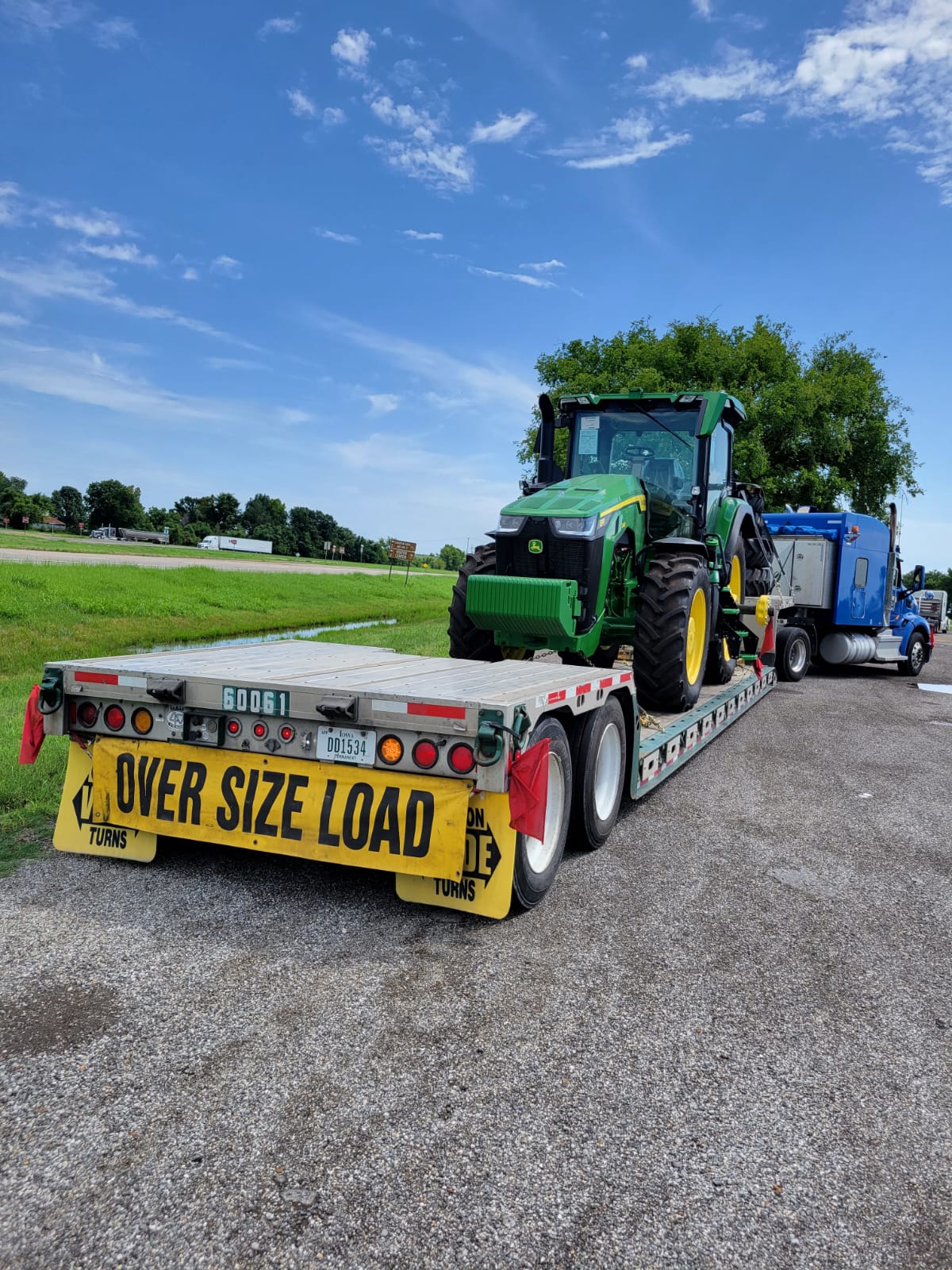 Lowboy green tractor